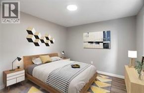 Wallaceburg apartment for rent - A bedroom with a bed, nightstands, and a painting on the wall.