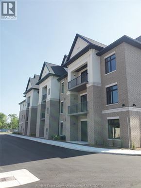 Lasalle condo for rent - A building with a balcony on the second floor.