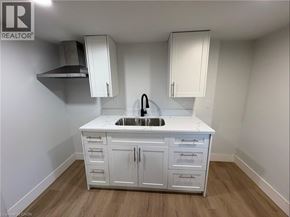 Port Colborne apartment for rent - A white kitchen with a sink and cabinets.