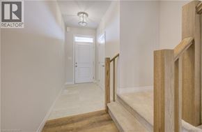 Cambridge apartment for rent - A hallway with a white door and a light on the ceiling.