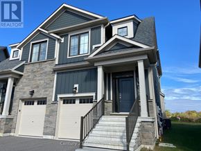 Blue Mountains apartment for rent - A large house with a stone foundation and a black roof.