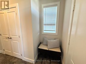 Blue Mountains apartment for rent - A white door with a glass window above a bench with two pillows.