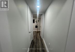 Brampton (Brampton West) apartment for rent - A long, narrow hallway with a light at the end.