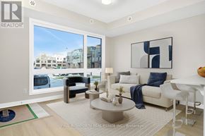 Ottawa condo for rent - A modern living room with a view of the street outside.