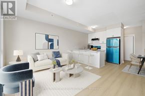 Ottawa condo for rent - A modern living room with a white sofa, a grey armchair, a coffee table, and a kitchen area in the background.