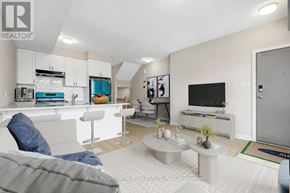 Ottawa condo for rent - A modern living room with a grey couch and a white kitchen area.