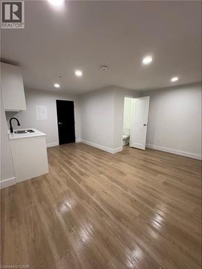Port Colborne apartment for rent - A room with wooden flooring and white walls.