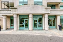 Toronto (Newtonbrook East) condo for rent - The front of a building with a large glass door and a sign that reads "Representation".