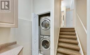 Vaughan (Vellore Village) apartment for rent - A washing machine is built into a wall in a home.