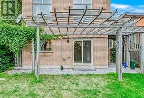 Vaughan (Vellore Village) apartment for rent - A patio with a pergola and a brick building in the background.