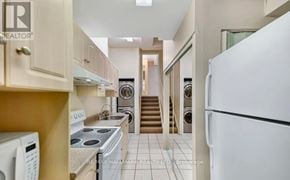 Vaughan (Vellore Village) apartment for rent - A kitchen with a white refrigerator, stove, and oven.