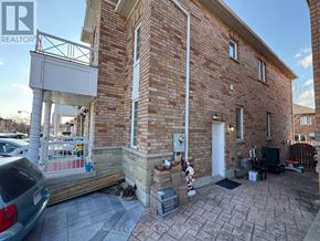 Markham (Greensborough) apartment for rent - A brick house with a porch and a car parked in front.