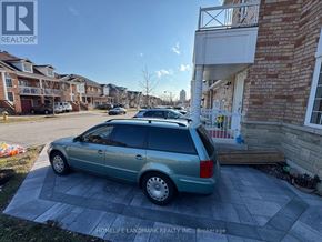 Markham (Greensborough) apartment for rent - A car is parked in a driveway in front of a house.