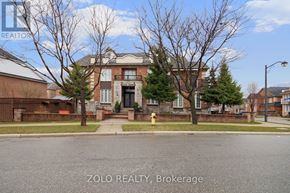 Toronto (Downsview-Roding-Cfb) apartment for rent - A house with a tree in front of it.