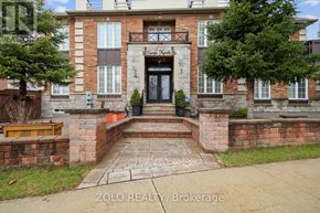 Toronto (Downsview-Roding-Cfb) apartment for rent - A brick building with a black door and windows.