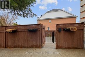 Toronto (Downsview-Roding-Cfb) apartment for rent - A house with a gate and a sign that says Zolo Realty, Brokerage.