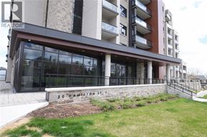 Waterdown condo for rent - A modern building with the name "30 Hamilton St." on the front.