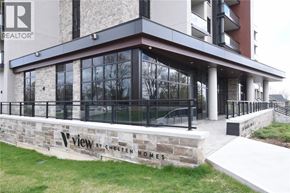 Waterdown condo for rent - A building with a sign that says "View by Cheuten Homes".