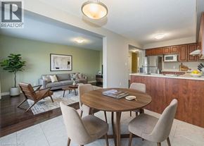 Kitchener townhouse for rent - A living room with a dining table and chairs.
