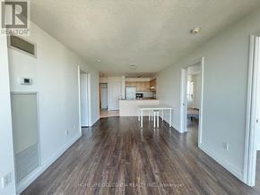 Toronto (Bendale) condo for rent - A room with wooden floors and white walls.