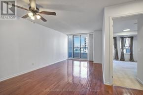 Richmond Hill (Langstaff) condo for rent - A room with a ceiling fan and wooden flooring.