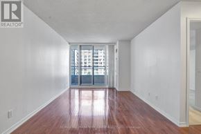 Richmond Hill (Langstaff) condo for rent - A room with a wooden floor and white walls.