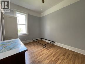 Windsor apartment for rent - A room with wooden flooring and a large window.