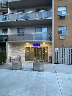 London South (South M) condo for rent - The image shows a building with a stone facade and a balcony on the second floor.