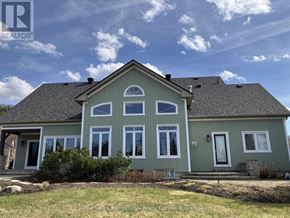 Blue Mountains apartment for rent - A house with a green exterior and a grey roof.