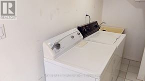 Markham (Grandview) apartment for rent - A white washing machine in a small room.