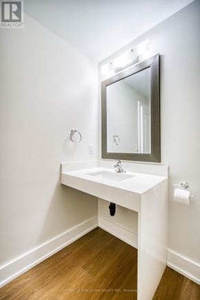 Oro-Medonte (Hawkestone) multi-family for rent - A white bathroom vanity with a mirror above it.