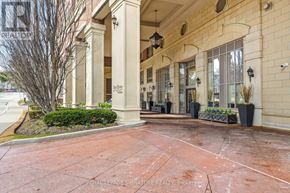 Oakville (Co Central) condo for rent - A building entrance with a sign that says "On The Dock".