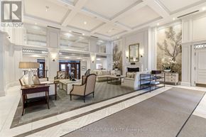 Oakville (Co Central) condo for rent - A well-lit, spacious living room with a large rug and a variety of seating options.