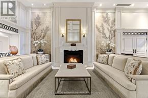 Oakville (Co Central) condo for rent - A living room with a fireplace and a couch.