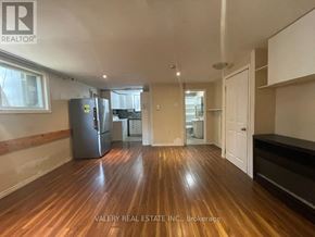Hamilton (Balfour) apartment for rent - A room with wooden flooring and a refrigerator in it.