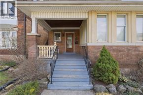 Hamilton apartment for rent - A house with a front porch and a sign that says "REALTOR".