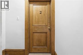 Hamilton apartment for rent - A wooden door with a number 2 on it.