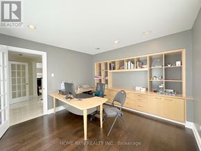 Ottawa apartment for rent - A home office with a desk, chair, and shelves.