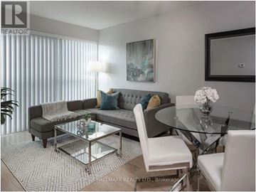 Toronto (Bay Street Corridor) condo for rent - A modern living room with a glass table and white chairs.
