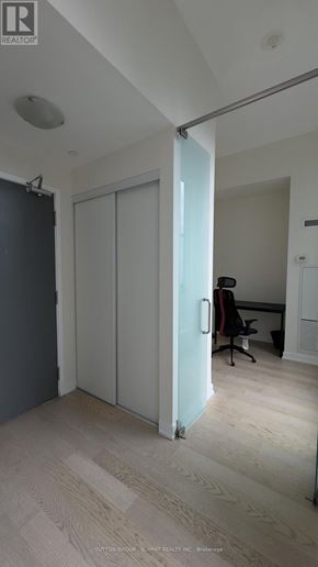 Toronto (Church-Yonge Corridor) condo for rent - A room with a white door and a black chair.