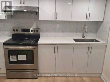 Toronto (Milliken) apartment for rent - A kitchen with a stove and sink.