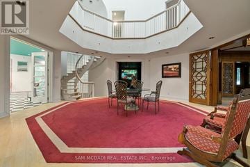 Caledon apartment for rent - A living room with a red carpet and a spiral staircase.