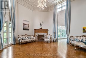Caledon apartment for rent - A large, elegant room with a fireplace and a chandelier.