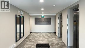 Lasalle condo for rent - A hallway with a sign that says "The Crossing at Heritage".