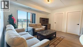 Lasalle condo for rent - A living room with a Christmas tree and a large window.