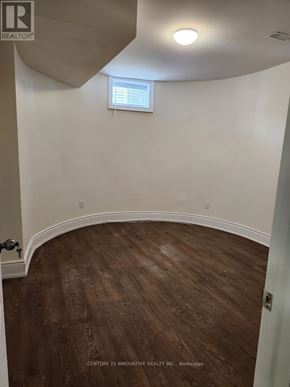 Toronto (Scarborough Village) apartment for rent - A room with wooden flooring and a window with blinds.