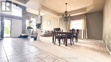 Markham (Rouge Fairways) apartment for rent - A living room with a dining table and chairs.
