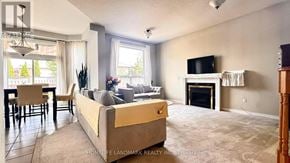 Markham (Rouge Fairways) apartment for rent - A living room with a fireplace and a couch.