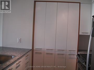 Toronto (Islington-City Centre West) condo for rent - A kitchen with a sink, cabinets and a refrigerator.