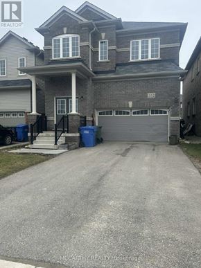 Southgate apartment for rent - A large house with a driveway in front of it.